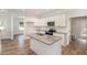 Kitchen with a center island, stainless steel appliances, granite countertops, and white cabinets at 454 Martins Mill Ct, Wendell, NC 27591