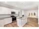 Kitchen featuring an island, stainless steel appliances, granite countertops, and an open view to the patio at 454 Martins Mill Ct, Wendell, NC 27591
