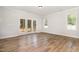 Bright living room featuring hardwood floors and glass doors leading to the outdoors at 454 Martins Mill Ct, Wendell, NC 27591