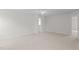 Neutral bedroom with neutral carpet and bright doorway to the en suite bathroom at 4716 Miller Dr, Durham, NC 27704
