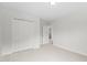 Bright bedroom with closet and neutral carpet for a serene, move-in-ready space at 4716 Miller Dr, Durham, NC 27704