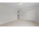 Neutral bedroom featuring closet space and access to a walk-in closet at 4716 Miller Dr, Durham, NC 27704