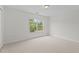 Bright bedroom with neutral carpet and natural light from the window at 4716 Miller Dr, Durham, NC 27704