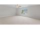 Bright bedroom with a ceiling fan and window with a neighborhood view at 4716 Miller Dr, Durham, NC 27704