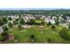 Aerial view of a community park with playground, walking path and gazebo surrounded by mature trees at 4716 Miller Dr, Durham, NC 27704