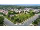 Aerial view of a community park with a playground and walking path surrounded by mature trees at 4716 Miller Dr, Durham, NC 27704