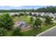 Aerial view of a community park with playground, walking path and gazebo amidst mature trees at 4716 Miller Dr, Durham, NC 27704