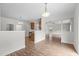 Bright dining area with wood-look flooring, open to the kitchen and living spaces for seamless living at 4716 Miller Dr, Durham, NC 27704