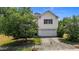 Two story home featuring a large front yard, attached garage, and lovely curb appeal at 4716 Miller Dr, Durham, NC 27704