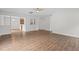 Bright, open living room boasts modern flooring, natural light, and a ceiling fan for comfortable living at 4716 Miller Dr, Durham, NC 27704