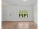 Bright living room with hardwood floors, white walls and natural light at 4716 Miller Dr, Durham, NC 27704