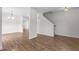 Bright living room with hard wood floors and a staircase at 4716 Miller Dr, Durham, NC 27704