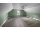 Finished attic features vaulted ceiling and a window with white shutters at 495 Ruth Cir, Fuquay Varina, NC 27526