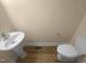 Cozy half bath featuring a pedestal sink and stylish flooring at 495 Ruth Cir, Fuquay Varina, NC 27526