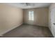 Bedroom with a ceiling fan and neutral carpet, complemented by plantation shutters at 495 Ruth Cir, Fuquay Varina, NC 27526