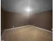 Empty bedroom featuring neutral carpet, walls and modern recessed lighting at 495 Ruth Cir, Fuquay Varina, NC 27526