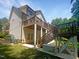 Backyard view of home showing wooden deck, stairs, and a Generac generator at 495 Ruth Cir, Fuquay Varina, NC 27526
