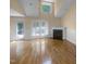 Open living area with hardwood floors, fireplace, and natural light at 495 Ruth Cir, Fuquay Varina, NC 27526