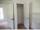 Bedroom closet with bi-fold doors reveals ample hanging storage and upper shelf at 5004 Us 70 Alt, Princeton, NC 27569