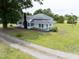 Two-story farmhouse with inviting front porch and large front yard at 5004 Us 70 Alt, Princeton, NC 27569