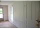 Entry hall with white walls, beadboard wainscoting, neutral carpet, and natural light at 5004 Us 70 Alt, Princeton, NC 27569