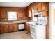 Functional kitchen featuring wood cabinets, laminate countertops, and modern appliances at 5004 Us 70 Alt, Princeton, NC 27569