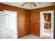Cozy living room with wooden paneling and open doorways at 5004 Us 70 Alt, Princeton, NC 27569