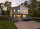 Charming two-story home with a modern design and a well-manicured lawn and a spacious driveway at 505 Colleton Rd, Raleigh, NC 27610