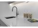 Contemporary kitchen features a sleek sink, quartz countertop, and modern decor at 505 Colleton Rd, Raleigh, NC 27610