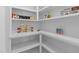 Organized walk-in pantry featuring ample shelving for storage and various food items at 505 Colleton Rd, Raleigh, NC 27610