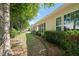 View of the home's rear, featuring a covered patio and well-maintained landscaping at 621 Aylestone Dr, Cary, NC 27519