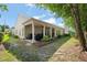Backyard with a covered patio that includes outdoor seating and a grill at 621 Aylestone Dr, Cary, NC 27519