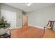 Inviting bedroom with hardwood floors, gray walls and views to connecting bath at 621 Aylestone Dr, Cary, NC 27519