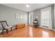 Light and airy bedroom featuring natural light, wood floors, and decorative furniture at 621 Aylestone Dr, Cary, NC 27519