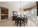Bright dining area with modern light fixture, large windows, and dark wood table with seating for six at 621 Aylestone Dr, Cary, NC 27519