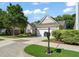 Charming home exterior with well-manicured lawn, mature tree, and inviting curb appeal at 621 Aylestone Dr, Cary, NC 27519