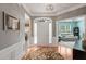 Bright foyer featuring hardwood floors, elegant lighting, and views into the living spaces at 621 Aylestone Dr, Cary, NC 27519