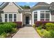 Inviting front entrance with classic door, sidelights, and decorative landscaping at 621 Aylestone Dr, Cary, NC 27519