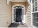 Close up of the beautiful black front door with sidelights and an arched transom window at 621 Aylestone Dr, Cary, NC 27519