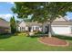 Charming home featuring mature landscaping, a well-maintained lawn, and a two-car garage at 621 Aylestone Dr, Cary, NC 27519