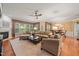 Bright living room featuring hardwood flooring, a fireplace, and large windows at 621 Aylestone Dr, Cary, NC 27519