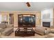 Comfortable living room with hardwood floors, a fireplace, and neutral decor at 621 Aylestone Dr, Cary, NC 27519