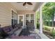 Inviting covered patio with comfortable seating and a view of the well-manicured backyard at 621 Aylestone Dr, Cary, NC 27519
