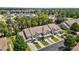 An aerial view of townhomes with lush trees, manicured lawns, and private driveways at 8323 Yaxley Hall Dr, Raleigh, NC 27616