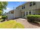 An exterior view of the backyard with a patio, privacy fence, and well-maintained landscaping at 8323 Yaxley Hall Dr, Raleigh, NC 27616