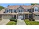 Charming townhome with brick accents, two-car garage, and well-maintained landscaping at 8323 Yaxley Hall Dr, Raleigh, NC 27616