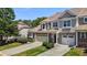 A townhouse showcasing its exterior with brick accents, complemented by a well-manicured lawn at 8323 Yaxley Hall Dr, Raleigh, NC 27616
