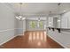 Open concept floor plan with hardwood floors and recessed lighting and plenty of natural light at 8323 Yaxley Hall Dr, Raleigh, NC 27616