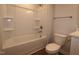 Bathroom features a shower-tub, commode, and vanity at 912 Montague Ave, Durham, NC 27703