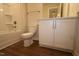 Bathroom features a shower-tub, commode, and vanity at 912 Montague Ave, Durham, NC 27703